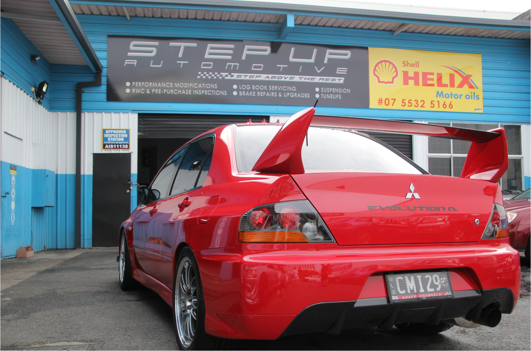 Red Evo 9 at Step Up Automotive workshop